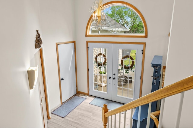2001 Stonepine Ave, Hudson, WI 54016 - entrance foyer featuring french doors, healthy amount of natural light, a chandelier, and a towering ceiling
