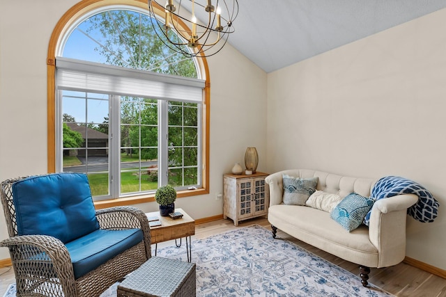 2001 Stonepine Ave, Hudson, WI 54016 - living area with vaulted ceiling, a chandelier, baseboards, and wood finished floors
