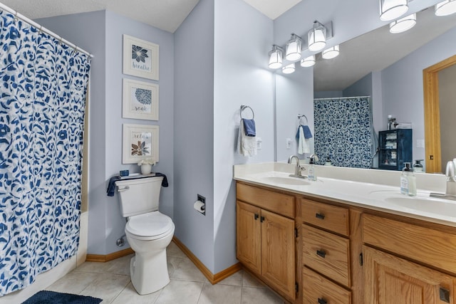 2001 Stonepine Ave, Hudson, WI 54016 - bathroom with double vanity, tile patterned floors, toilet, curtained shower, and baseboards