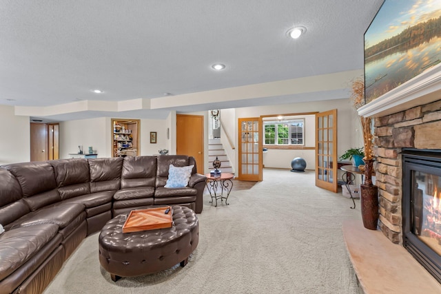 2001 Stonepine Ave, Hudson, WI 54016 - living room with carpet floors, a fireplace, stairs, french doors, and recessed lighting