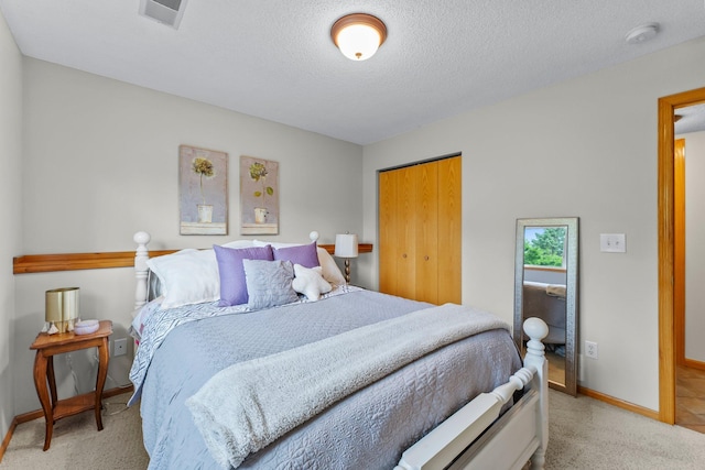 2001 Stonepine Ave, Hudson, WI 54016 - bedroom with carpet flooring, baseboards, a textured ceiling, and a closet