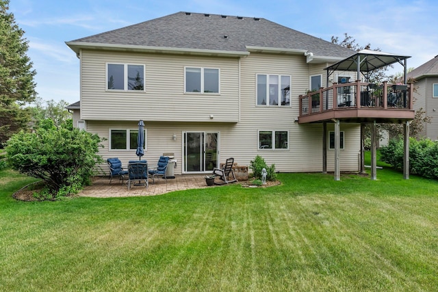 2001 Stonepine Ave, Hudson, WI 54016 - back of house with a yard, roof with shingles, and a patio
