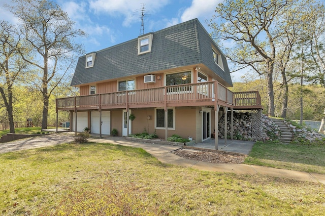6032 Quinn Ave NW, Annandale, MN 55302 - back of house with mansard roof, a shingled roof, a garage, and a wooden deck
