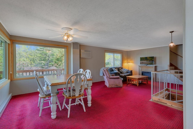6032 Quinn Ave NW, Annandale, MN 55302 - dining area featuring carpet flooring, a fireplace, ceiling fan, stairs, and a textured ceiling