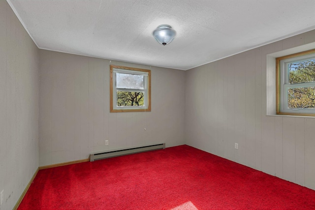 6032 Quinn Ave NW, Annandale, MN 55302 - spare room with a baseboard radiator, carpet, wooden walls, and a textured ceiling