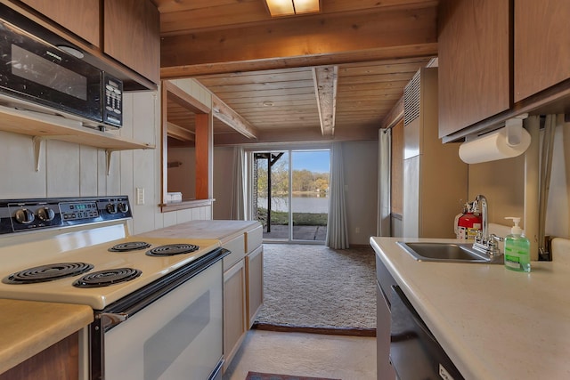 6032 Quinn Ave NW, Annandale, MN 55302 - kitchen featuring electric range, wood ceiling, a sink, light countertops, and light colored carpet