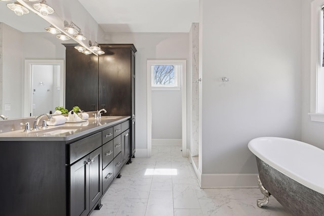 648 Sunset Ln, Mendota Heights, MN 55118 - full bathroom featuring baseboards, marble finish flooring, a soaking tub, and double vanity