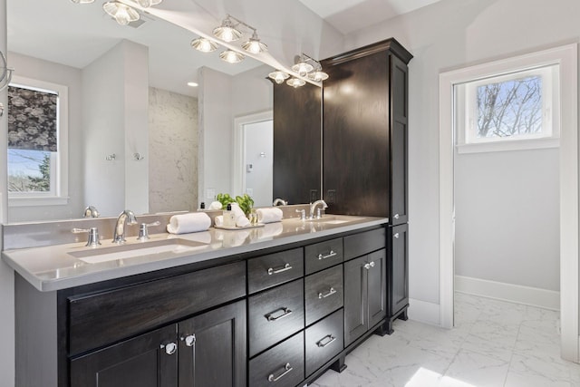 648 Sunset Ln, Mendota Heights, MN 55118 - full bath with plenty of natural light, marble look tile flooring, double vanity, and baseboards