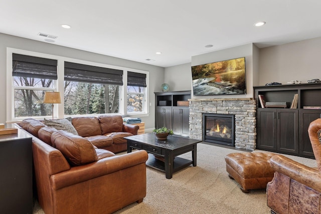 648 Sunset Ln, Mendota Heights, MN 55118 - carpeted living area featuring a stone fireplace and recessed lighting