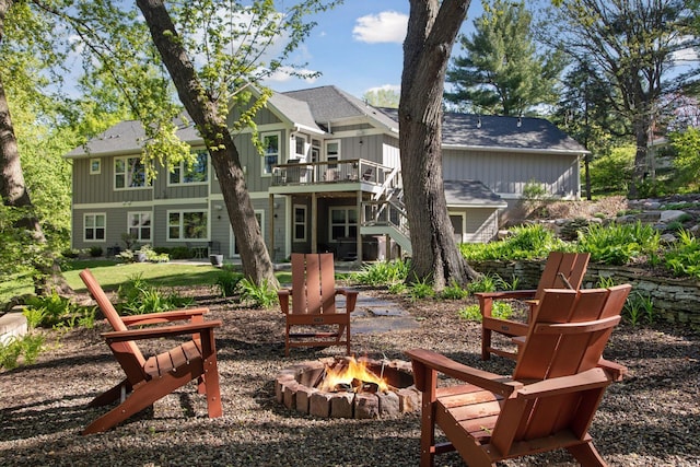 648 Sunset Ln, Mendota Heights, MN 55118 - back of house featuring a fire pit, board and batten siding, a deck, and stairs