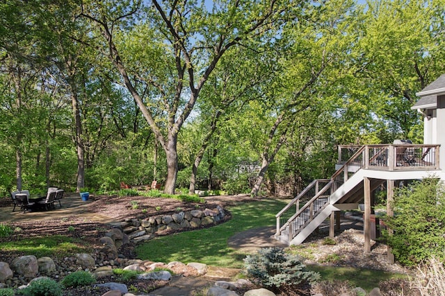 648 Sunset Ln, Mendota Heights, MN 55118 - view of green lawn featuring stairs, a wooden deck, and a patio