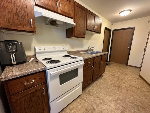 kitchen with white electric range oven, a sink, under cabinet range hood, dark countertops, and dark brown cabinetry