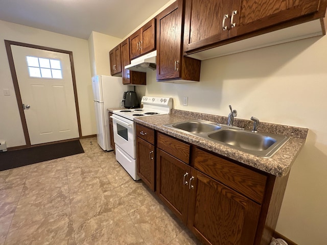kitchen with white appliances, under cabinet range hood, a sink, dark countertops, and dark brown cabinets