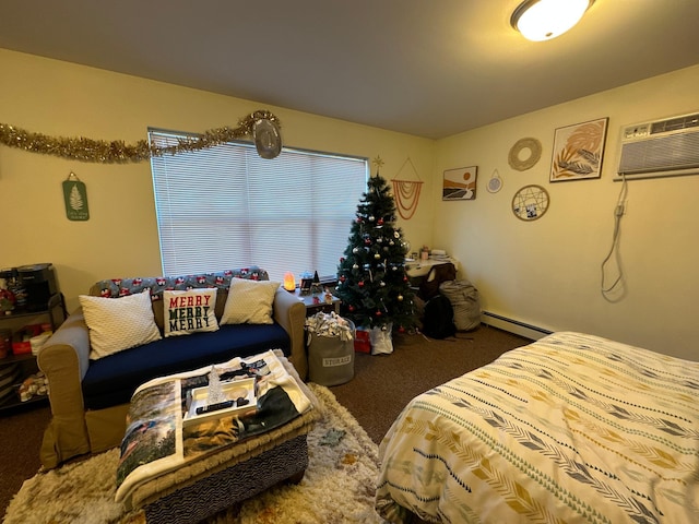 bedroom with carpet floors, a baseboard heating unit, and a wall unit AC
