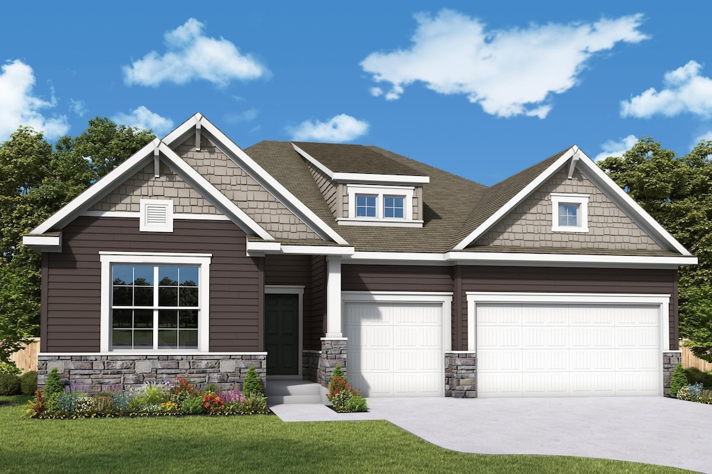 craftsman-style home featuring stone siding, driveway, a front yard, and an attached garage