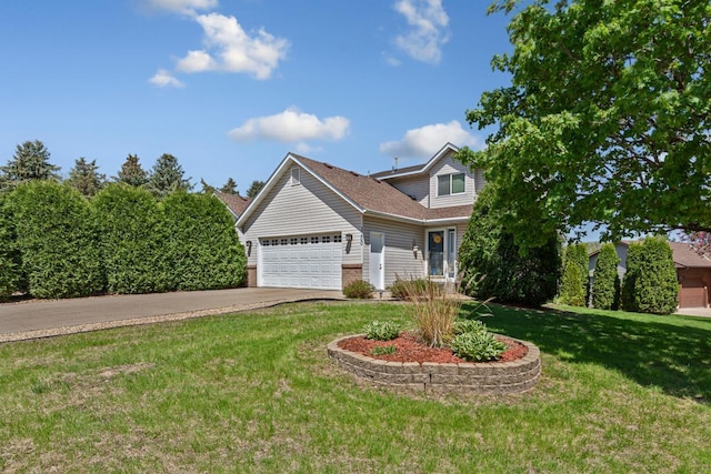 2200 15 1/2 St NW, Faribault, MN 55021 - view of front of property featuring a garage, driveway, a front lawn, a shingled roof, and brick siding