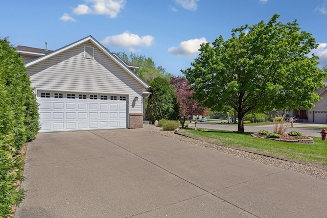 2200 15 1/2 St NW, Faribault, MN 55021 - view of side of property featuring a garage and brick siding