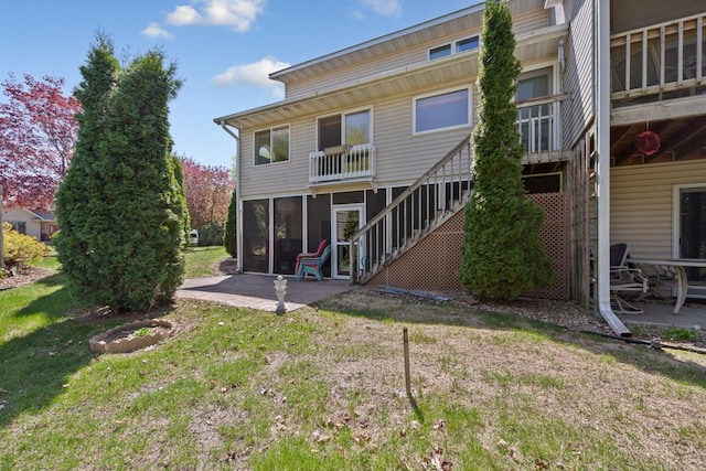 2200 15 1/2 St NW, Faribault, MN 55021 - rear view of property featuring a patio area, a lawn, and stairway