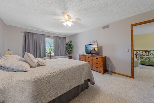 2200 15 1/2 St NW, Faribault, MN 55021 - bedroom with light carpet, a textured ceiling, ceiling fan, and baseboards