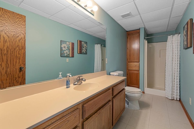 2200 15 1/2 St NW, Faribault, MN 55021 - bathroom featuring a drop ceiling, tile patterned floors, a shower with shower curtain, toilet, and vanity