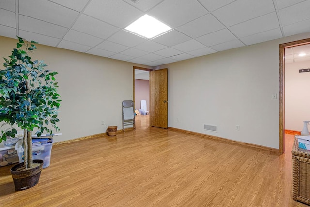 2200 15 1/2 St NW, Faribault, MN 55021 - spare room with wood finished floors, a drop ceiling, and baseboards