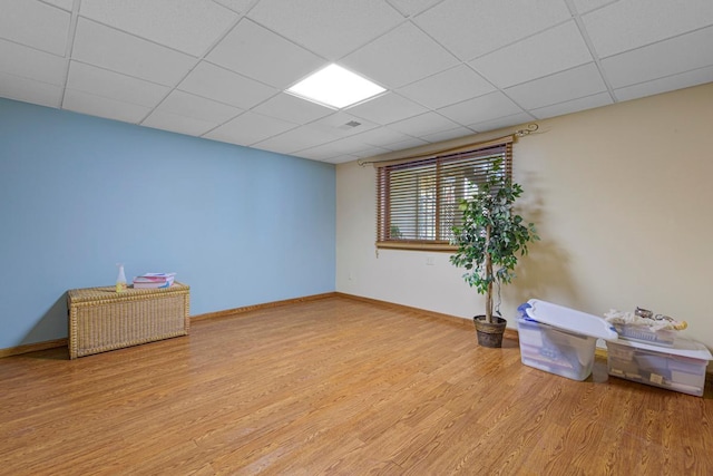 2200 15 1/2 St NW, Faribault, MN 55021 - basement featuring a drop ceiling, wood finished floors, and baseboards