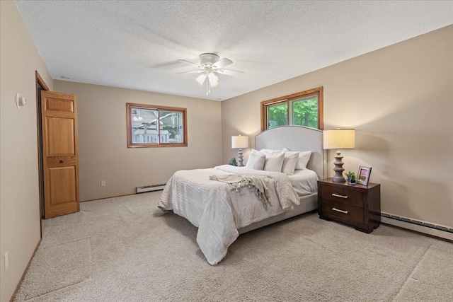 5935 County Road 11, Independence, MN 55359 - bedroom featuring a baseboard radiator, light carpet, a baseboard heating unit, a ceiling fan, and baseboards