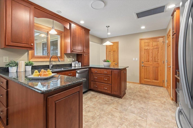 5935 County Road 11, Independence, MN 55359 - kitchen with a sink, stainless steel appliances, a peninsula, decorative light fixtures, and dark stone countertops