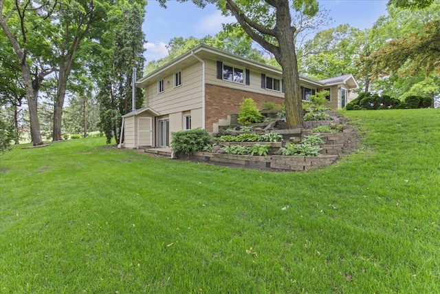 5935 County Road 11, Independence, MN 55359 - view of property exterior with brick siding and a lawn