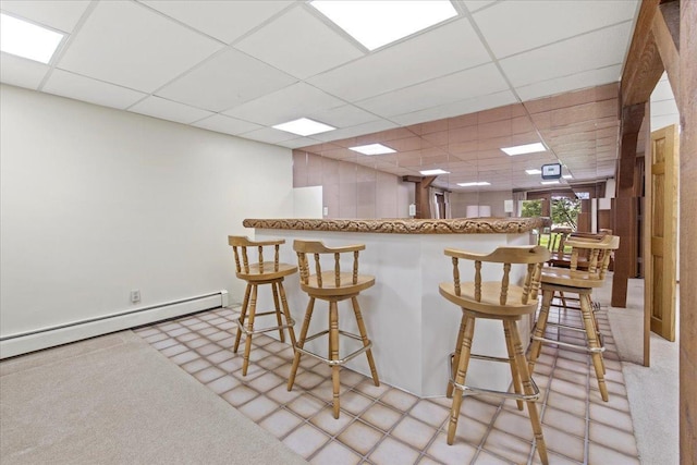 5935 County Road 11, Independence, MN 55359 - kitchen with a drop ceiling, a baseboard radiator, and a kitchen breakfast bar