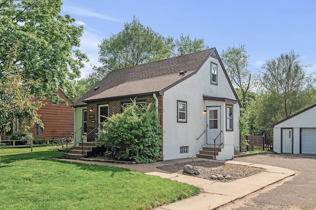 view of front of house featuring entry steps, an outdoor structure, stucco siding, roof with shingles, and a garage