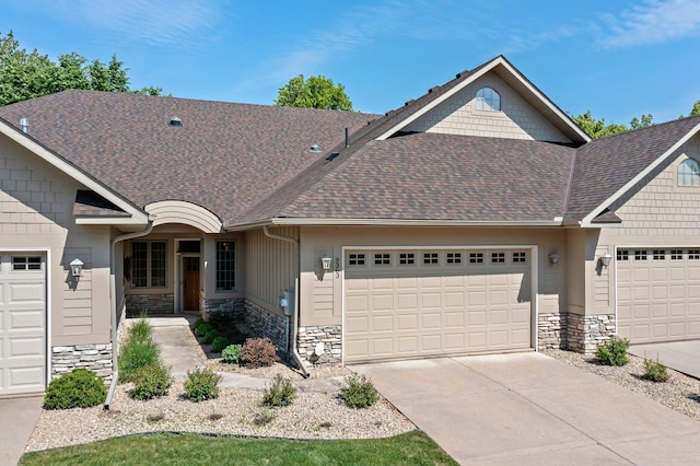 9363 Libby Ln, Eden Prairie, MN 55347 - craftsman-style home with stone siding, a garage, and roof with shingles