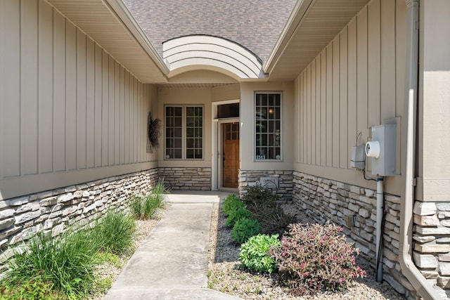 9363 Libby Ln, Eden Prairie, MN 55347 - property entrance with a shingled roof and stone siding