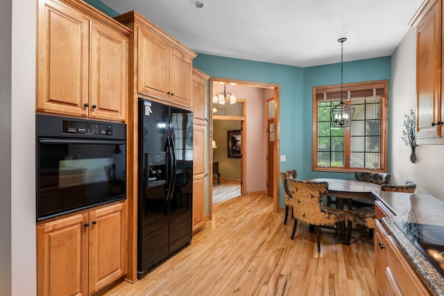 9363 Libby Ln, Eden Prairie, MN 55347 - kitchen featuring black appliances, a chandelier, light wood-style flooring, and pendant lighting