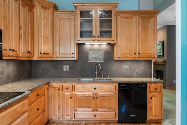 9363 Libby Ln, Eden Prairie, MN 55347 - kitchen with black appliances, a sink, stone counters, and glass insert cabinets