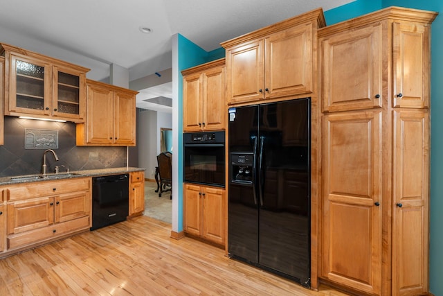 9363 Libby Ln, Eden Prairie, MN 55347 - kitchen with black appliances, a sink, dark stone counters, light wood-type flooring, and recessed lighting