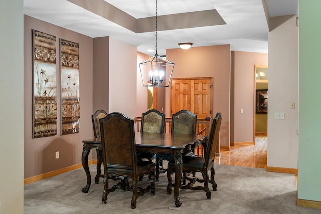 9363 Libby Ln, Eden Prairie, MN 55347 - dining area with a chandelier, light colored carpet, and baseboards