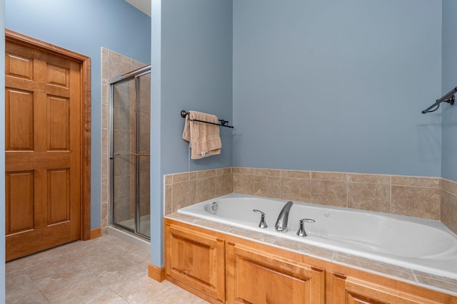 9363 Libby Ln, Eden Prairie, MN 55347 - bathroom with a bath, a shower stall, and tile patterned floors