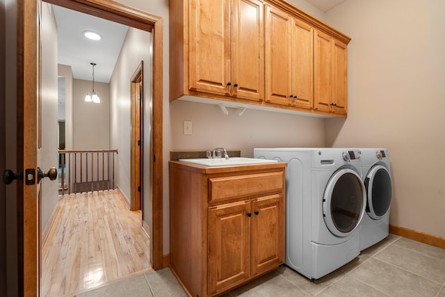 9363 Libby Ln, Eden Prairie, MN 55347 - laundry room featuring washing machine and dryer, cabinet space, baseboards, and light tile patterned flooring