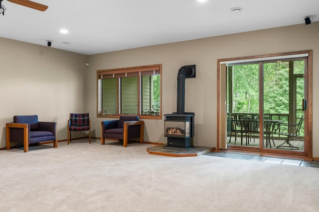 9363 Libby Ln, Eden Prairie, MN 55347 - living area with a wood stove, carpet flooring, recessed lighting, baseboards, and ceiling fan