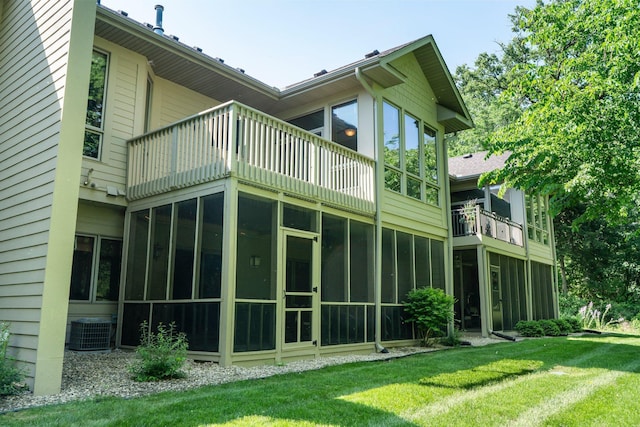9363 Libby Ln, Eden Prairie, MN 55347 - back of house with cooling unit, a balcony, a yard, and a sunroom