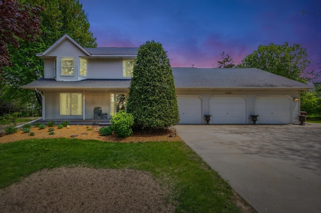 5155 Allen Dr, Woodbury, MN 55129 - view of front facade with driveway, covered porch, a garage, a shingled roof, and a lawn