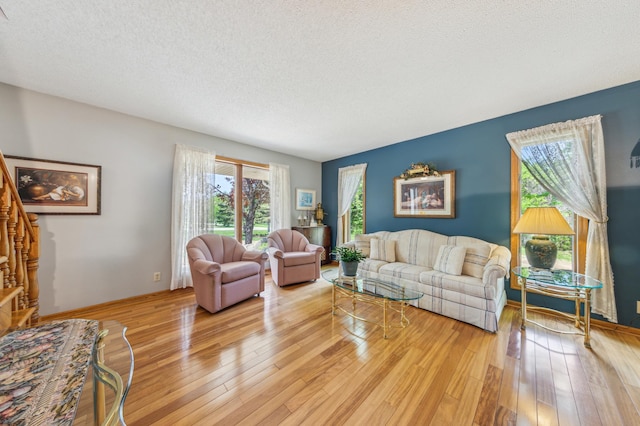 5155 Allen Dr, Woodbury, MN 55129 - living room with light wood-style flooring and a textured ceiling