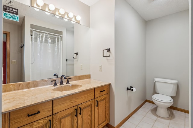 5155 Allen Dr, Woodbury, MN 55129 - bathroom with toilet, tile patterned floors, vanity, baseboards, and a textured ceiling