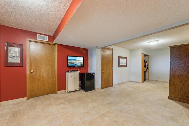 5155 Allen Dr, Woodbury, MN 55129 - unfurnished living room featuring a textured ceiling