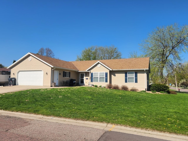 309 Oconnor St, Lakefield, MN 56150 - ranch-style home with a front lawn, an attached garage, and driveway
