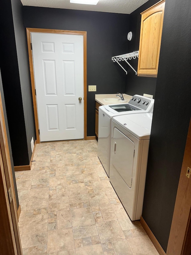309 Oconnor St, Lakefield, MN 56150 - laundry room with cabinet space, independent washer and dryer, and baseboards