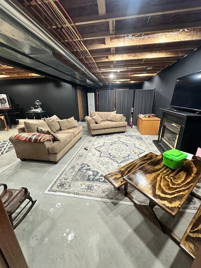 309 Oconnor St, Lakefield, MN 56150 - living area with concrete floors and a glass covered fireplace