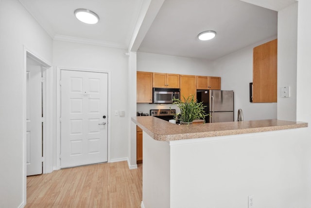 13560 Technology Dr Unit 1207, Eden Prairie, MN 55344 - kitchen featuring appliances with stainless steel finishes, light wood-type flooring, a peninsula, light countertops, and ornamental molding