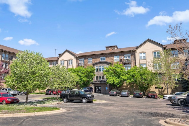 13560 Technology Dr Unit 1207, Eden Prairie, MN 55344 - view of building exterior featuring uncovered parking